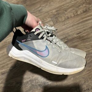 White Nikes with blue/pink accents